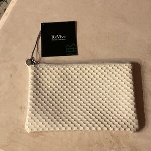 ReVive White patent textured Cosmetic Bag zippered